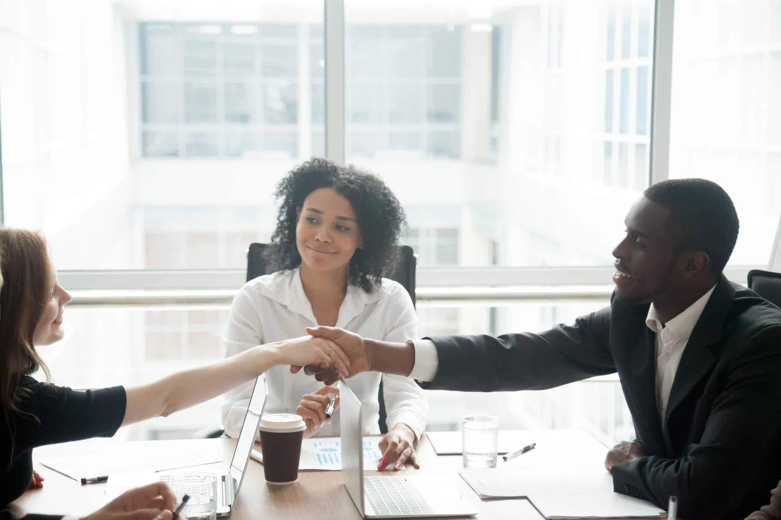 meeting of 2 professionals over a business law dispute personal injury attorney office