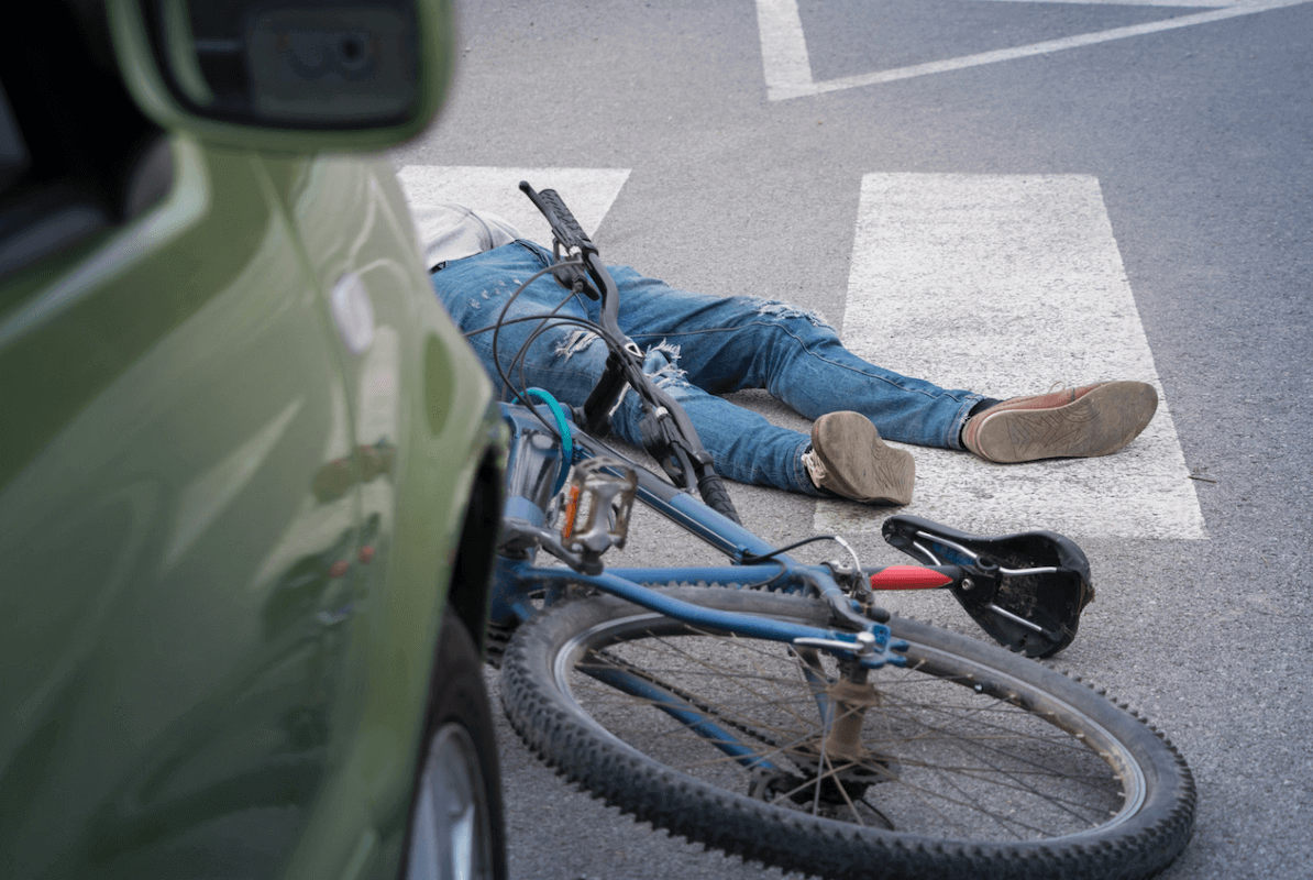 victim on the ground after a bicycle accident lawyer