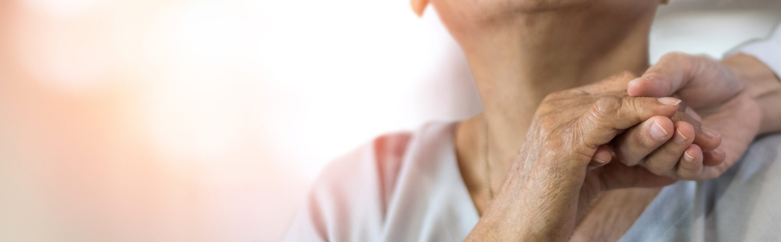 Geriatric doctor or geriatrician concept. Doctor physician hand on happy elderly senior patient to comfort in hospital examination room or hospice nursing home or wellbeing county.