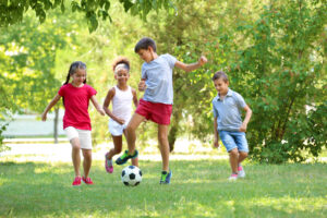 children playing soccer in the yard; potential child injury case