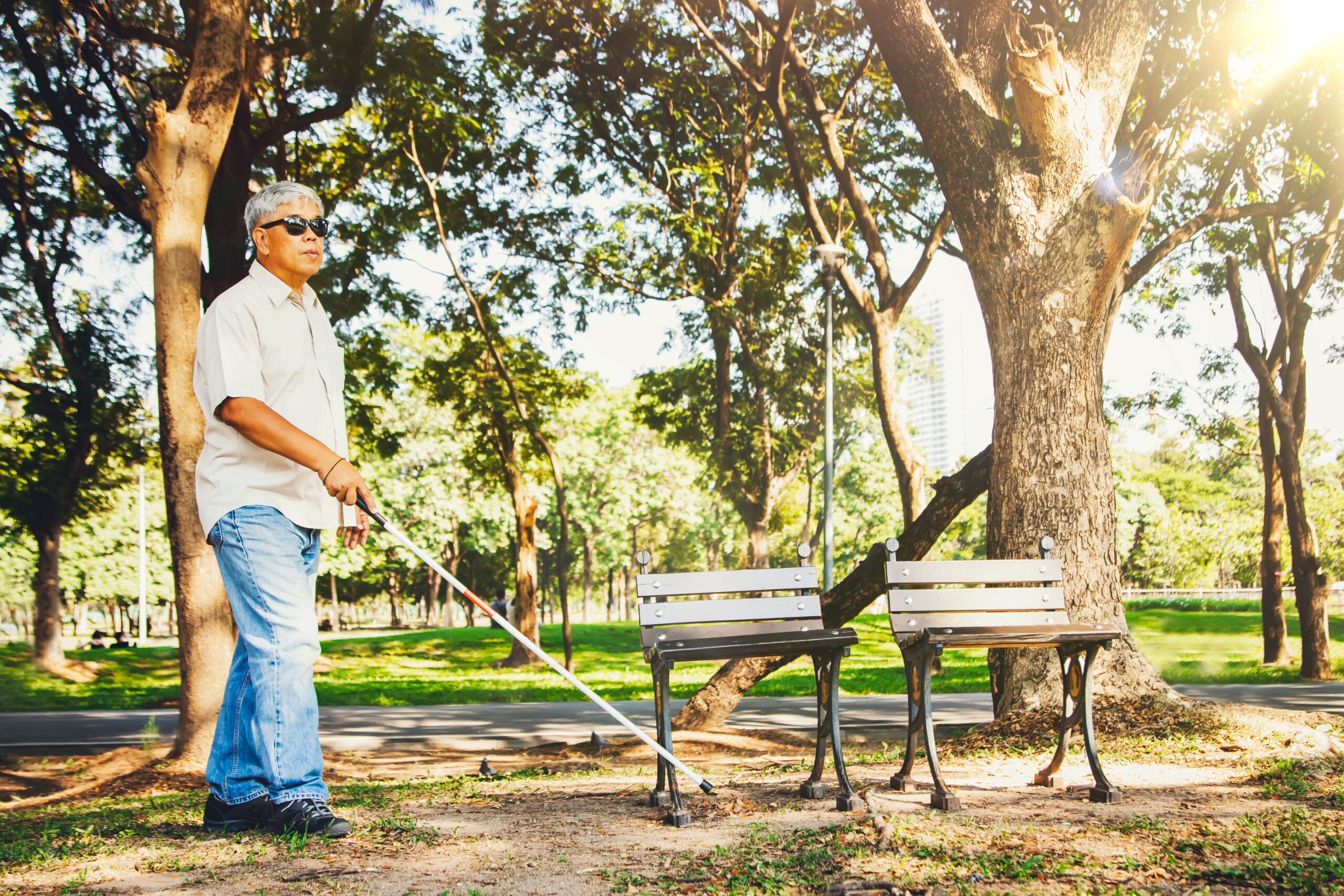 blind man traveling with disability