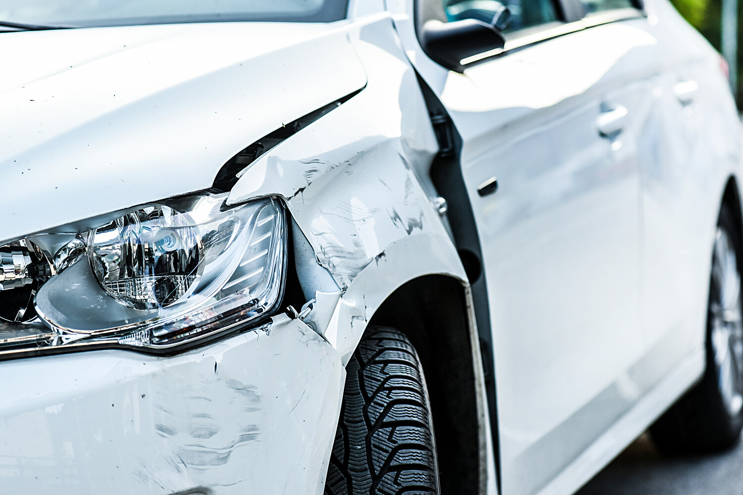 white car after a hit and run accident